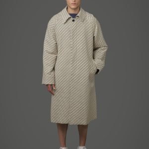 S/B long coat with mustard, olive green, and black star pattern on an off-white background.